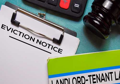 eviction mediation paperwork and landlord tenant law on desk